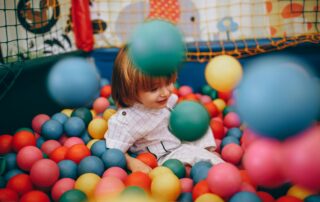 spring activities at kids fun City ball pit with child
