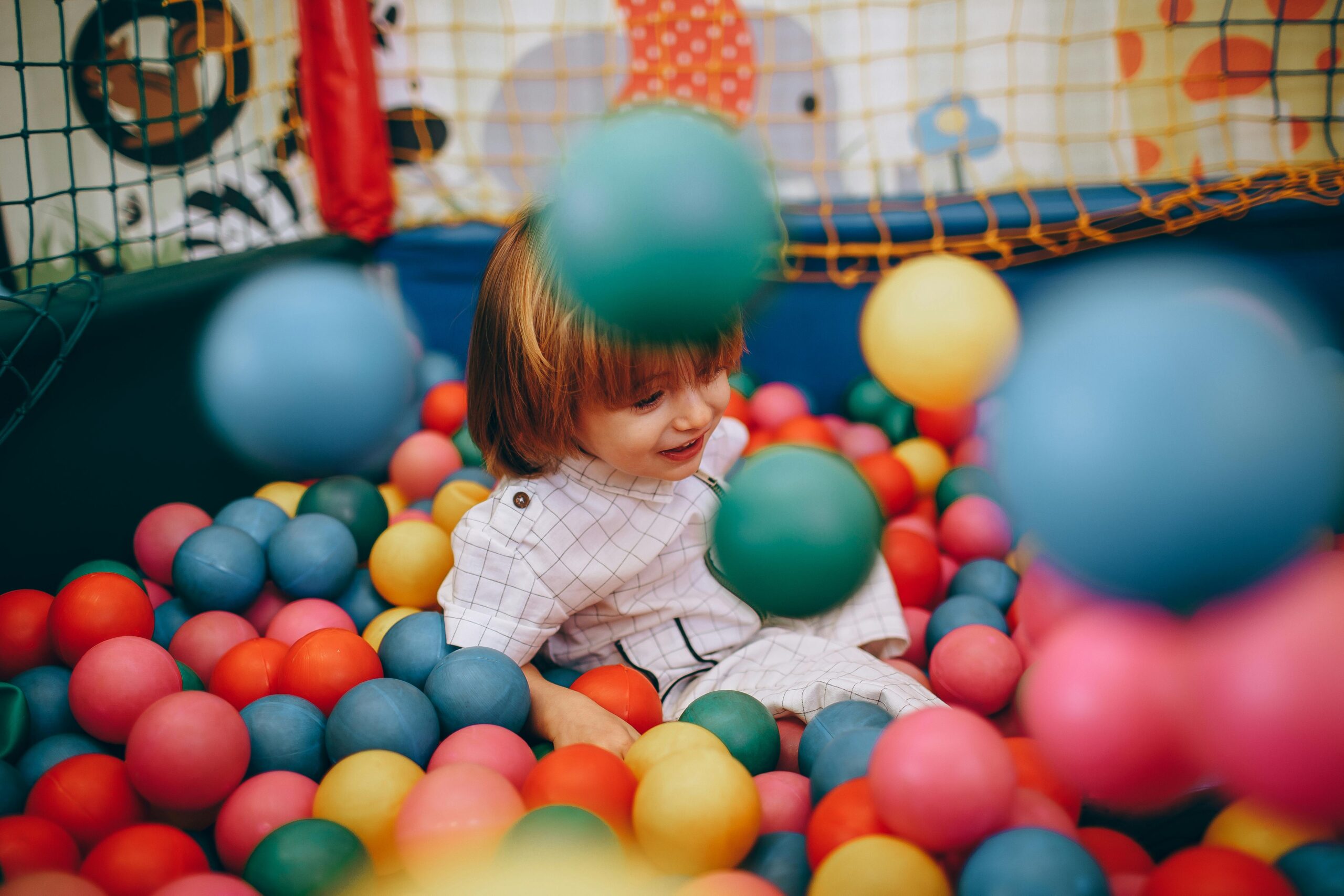 spring activities at kids fun City ball pit with child